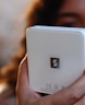 a close up of a person holding a cell phone