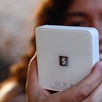 a close up of a person holding a cell phone